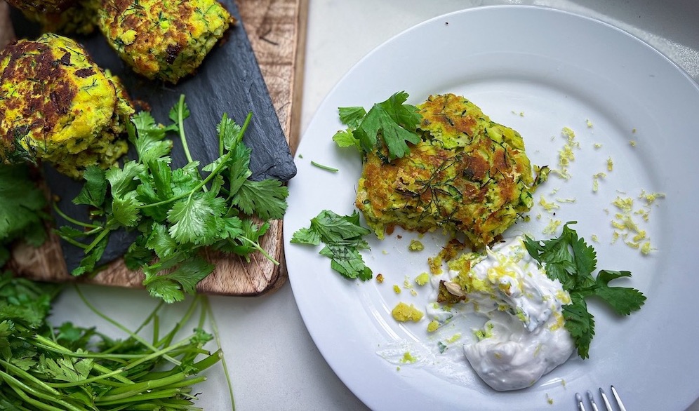 Crispy zucchini fritters with yogurt dipping sauce for a light summer dinner
