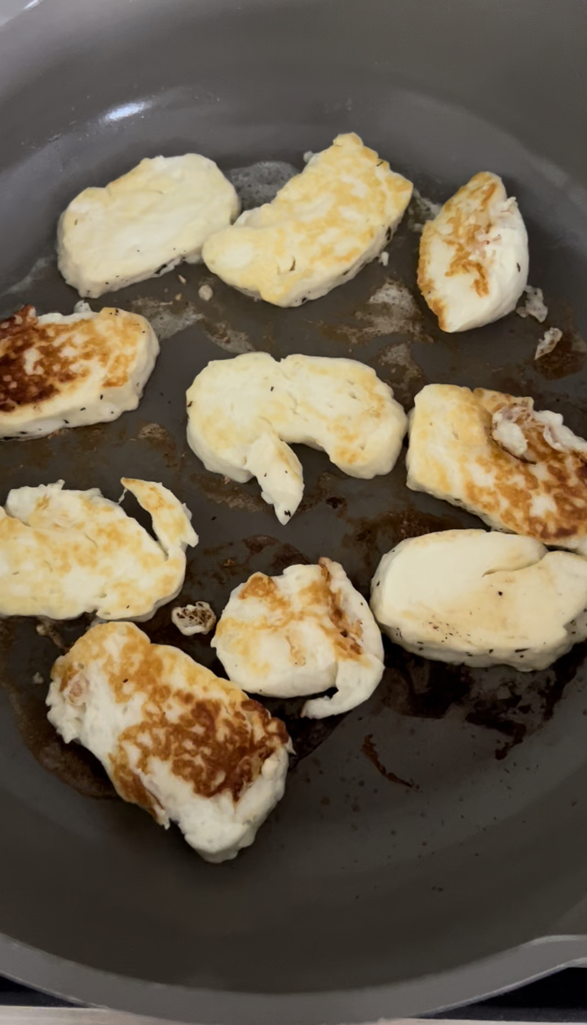 browned halloumi cheese in skillet
