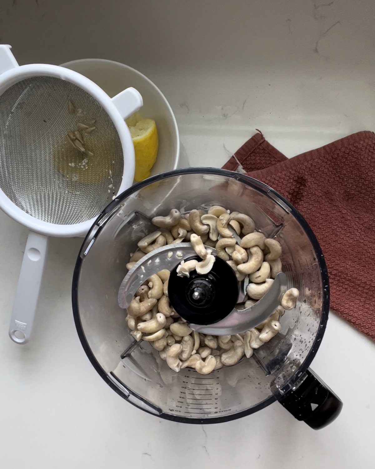 cashews, lemon juice, and water in a food processor