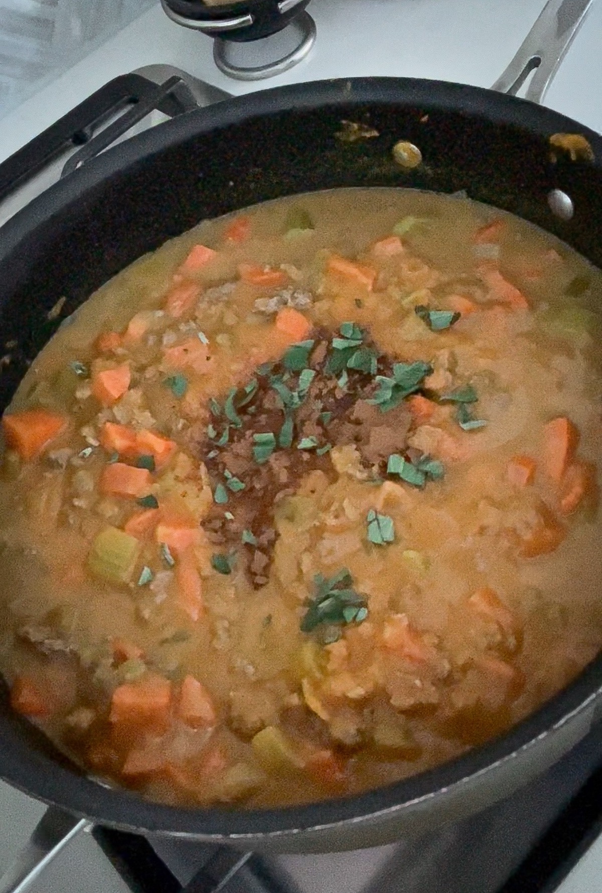 bolognese sauce simmering in a skillet