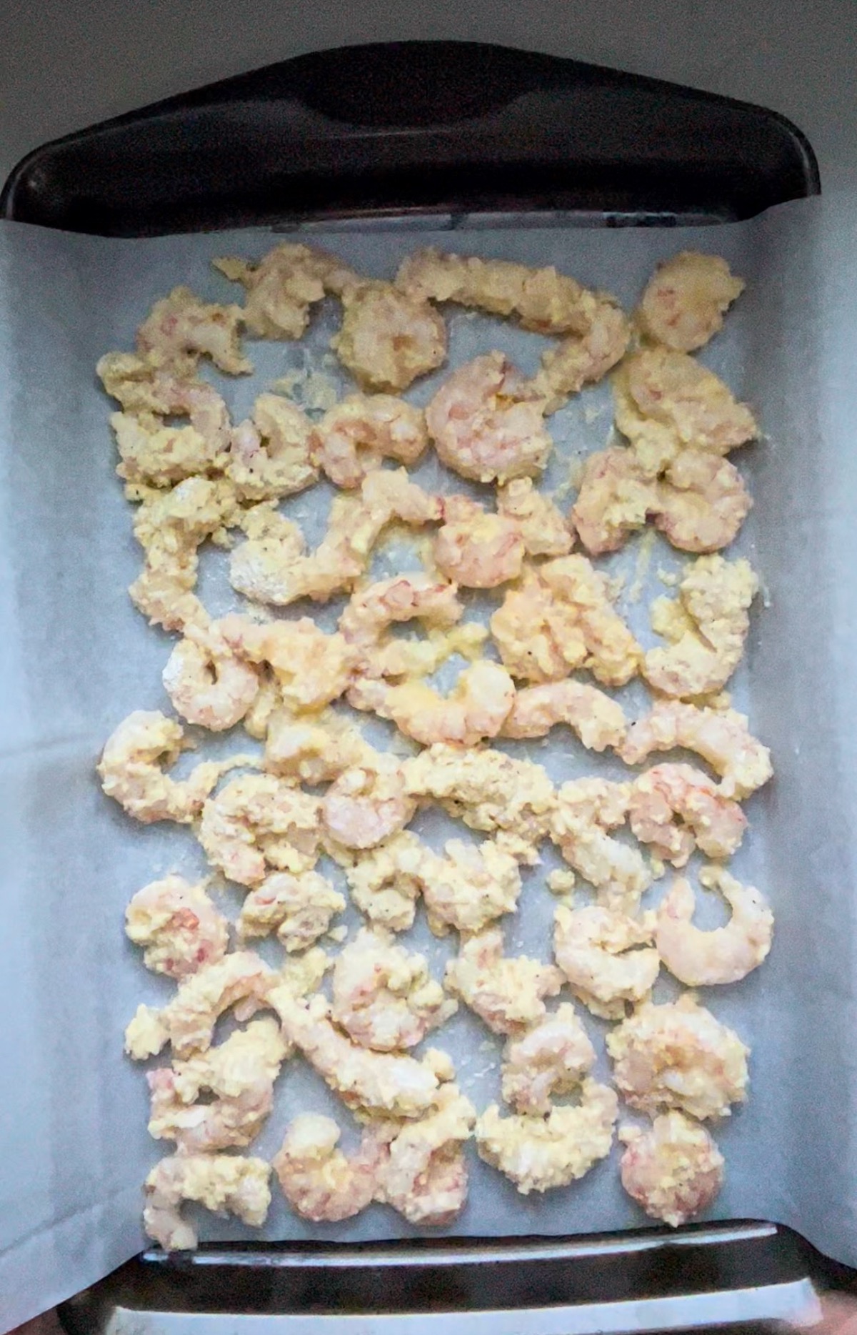 shrimp in a single layer on a baking sheet